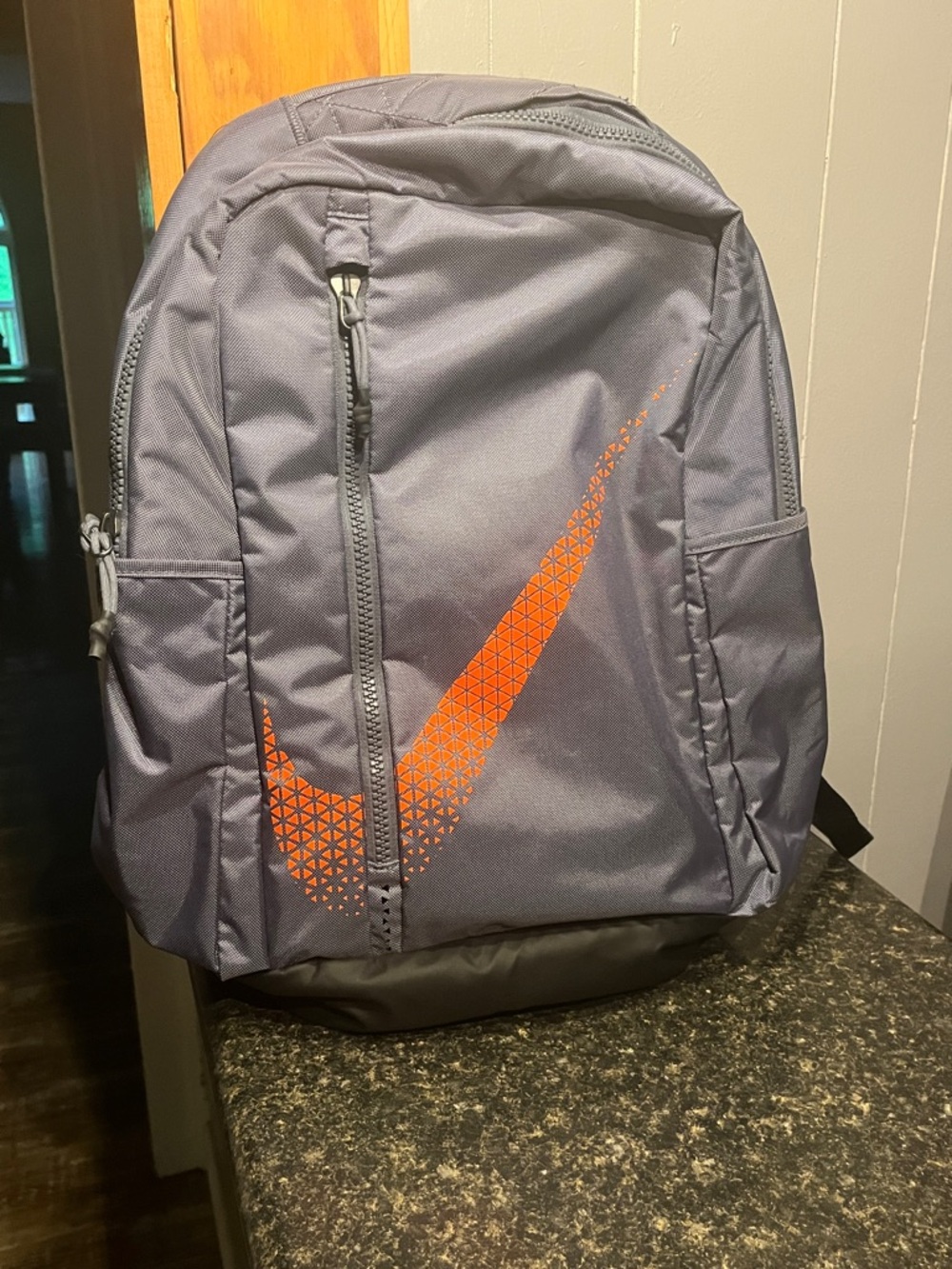 Nike Gray Backpack with Orange Geometric Swoosh
